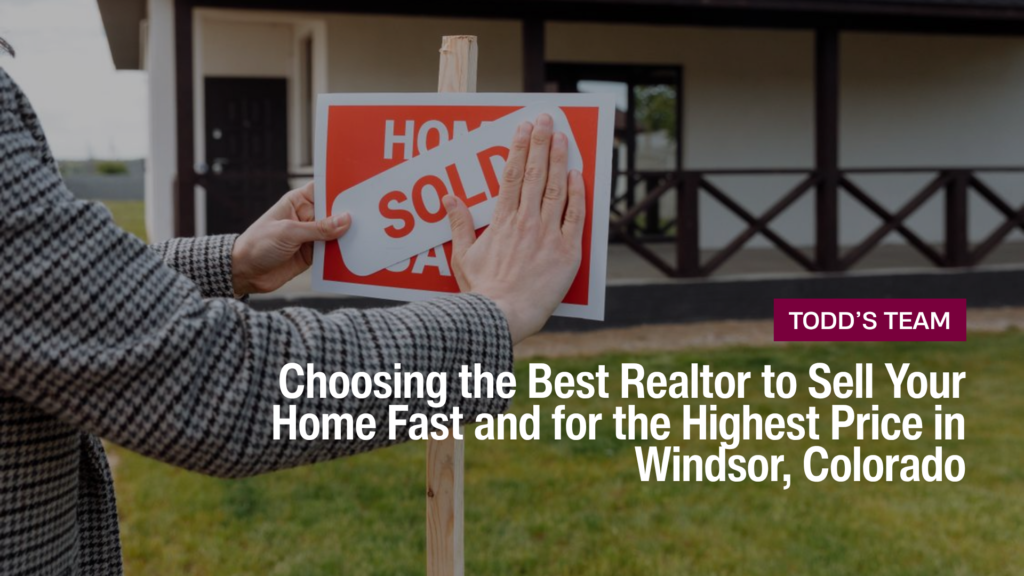 Person placing a sold sign in front of a home, illustrating Choosing the Best Realtor to Sell Your Home Fast and for the Highest Price in Windsor, Colorado.