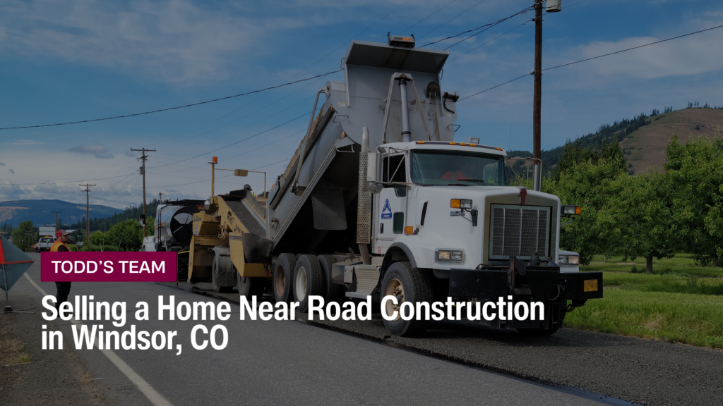 Road crew and dump truck paving a two-lane road, the disruption behind selling a home near road construction in Windsor CO