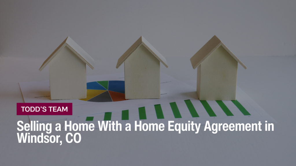 Three small wooden houses on financial charts, selling a home with a home equity agreement in Windsor, CO